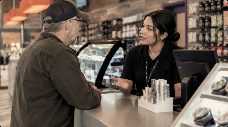 Higher Level Greenfield budtender helping a customer